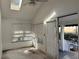 Sunroom with skylight, white walls, and view of the backyard at 822 Gulf Blvd # 4-6, Indian Rocks Beach, FL 33785