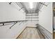 Spacious walk-in closet with wire shelving at 8614 Maidstone Ct, Seminole, FL 33777