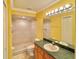Bathroom with a walk-in shower, single sink vanity and a large mirror at 9336 Villa Entrada, New Port Richey, FL 34655