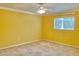 Bedroom with carpet floors, and a large window that lets in plenty of natural light at 9336 Villa Entrada, New Port Richey, FL 34655