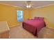 Bright bedroom with a queen bed and neutral colored walls at 9336 Villa Entrada, New Port Richey, FL 34655