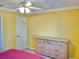 Bedroom with a dresser and neutral decor at 9336 Villa Entrada, New Port Richey, FL 34655