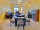 Bright dining room with a round table and four chairs at 9336 Villa Entrada, New Port Richey, FL 34655