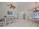 Bright dining room with a wooden table, high ceilings and lots of natural light at 9415 Sayre St, Riverview, FL 33569