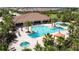 Aerial view of community pool with surrounding lounge chairs at 11715 Bitola Dr, Odessa, FL 33556