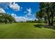 Expansive green golf course with mature trees and landscaping at 16317 Colwood Dr, Odessa, FL 33556