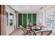 Bright home office featuring a green wall and comfortable seating at 18129 Canopy Pl, Lakewood Ranch, FL 34211