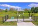 Fenced dog park with shaded seating area at 18292 Hunters Meadow Walk, Land O Lakes, FL 34638