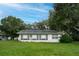 Front view of single story house with green lawn at 1901 N Highland Ave, Clearwater, FL 33755