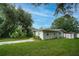 Side view of house with driveway and shed at 1901 N Highland Ave, Clearwater, FL 33755