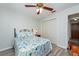 Charming bedroom with a comfortable bed and ceiling fan at 2203 Tail Feather Ct, Lutz, FL 33549