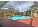 Inviting screened pool with spa and spacious deck at 2561 Regal River Rd, Valrico, FL 33596