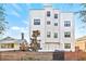 Modern three-story building with clean lines and a wood fence at 2710 1St S Ave, St Petersburg, FL 33712