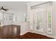 Bright entryway with hardwood floors and white plantation shutters at 2851 Bayshore Trails Dr, Tampa, FL 33611