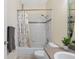 Bathroom featuring shower with curtain, and a gray towel at 3203 Audubon Ct, Tarpon Springs, FL 34688