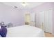 Bedroom featuring tile flooring, walk in closet, and fan at 3203 Audubon Ct, Tarpon Springs, FL 34688