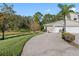Charming single-Gathering home features a well-manicured lawn, two-car garage, and inviting curb appeal at 3203 Audubon Ct, Tarpon Springs, FL 34688