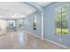 Bright living room with neutral paint, large windows and tile floors at 3203 Audubon Ct, Tarpon Springs, FL 34688