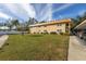 Building exterior with grassy area and walkway at 4500 E Bay Dr # 151, Clearwater, FL 33764