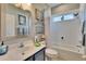 Bright bathroom with white subway tile, a soaking tub, and updated vanity at 5006 Tari Stream Way, Brandon, FL 33511