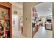 View into kitchen and bedroom from a hallway at 5006 Tari Stream Way, Brandon, FL 33511