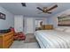 Bedroom featuring a king bed, chair, and mirrored closet at 512 Acacia Ln, Nokomis, FL 34275
