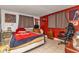 Cozy bedroom with a double bed and gaming chair at 512 Acacia Ln, Nokomis, FL 34275