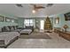 Spacious living room with tiled floors and comfy seating at 512 Acacia Ln, Nokomis, FL 34275
