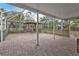 Covered patio with brick pavers and screened enclosure at 512 Acacia Ln, Nokomis, FL 34275