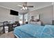 Bright bedroom with a comfortable bed, dresser, and large TV at 5156 Mentmore Ave, Spring Hill, FL 34606