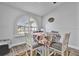 Bright breakfast nook features a round table and chairs, offering a cozy eat-in space at 5156 Mentmore Ave, Spring Hill, FL 34606