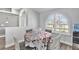 Small dining area with a round table and floral tablecloth at 5156 Mentmore Ave, Spring Hill, FL 34606