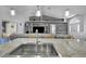 Large kitchen island with stainless steel sink and granite countertop at 5156 Mentmore Ave, Spring Hill, FL 34606