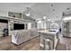 Open living space with a sectional sofa and kitchen island at 5156 Mentmore Ave, Spring Hill, FL 34606