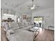 Spacious living room with sectional sofa and access to the pool at 5156 Mentmore Ave, Spring Hill, FL 34606