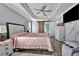 Large main bedroom with a king-size bed and barn door leading to the bathroom at 5156 Mentmore Ave, Spring Hill, FL 34606