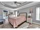 Spacious main bedroom with a comfy bed, dresser, and access to the pool at 5156 Mentmore Ave, Spring Hill, FL 34606