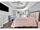 Main bedroom with a large bed, dresser, and a view to the pool at 5156 Mentmore Ave, Spring Hill, FL 34606