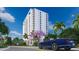 Modern building exterior with landscaping and street view at 5701 Bowen Daniel Dr. # 402, Tampa, FL 33616