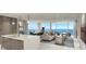 Open-concept living area with modern kitchen and ocean views at 5701 Bowen Daniel Dr. # 402, Tampa, FL 33616