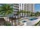 Resort-style pool and sundeck with cabanas and lush landscaping at 5701 Bowen Daniel Dr. # 402, Tampa, FL 33616