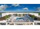 Resort-style pool and sundeck with lounge chairs and fitness center at 5701 Bowen Daniel Dr. # 402, Tampa, FL 33616