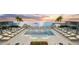 Stunning rooftop pool with ocean views and lounge chairs at 5701 Bowen Daniel Dr. # 402, Tampa, FL 33616