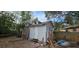 Backyard with sheds and various yard clutter at 6404 Pershing Ne St, St Petersburg, FL 33702