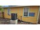 Rear exterior view of house showing AC unit and some landscaping at 6404 Pershing Ne St, St Petersburg, FL 33702