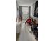 Hallway undergoing renovations with exposed walls and floor at 6404 Pershing Ne St, St Petersburg, FL 33702