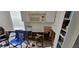 Another view of kitchen with damaged cabinetry and flooring at 6404 Pershing Ne St, St Petersburg, FL 33702