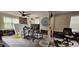 Living room with hardwood floor, needs renovation, and has some furniture at 6404 Pershing Ne St, St Petersburg, FL 33702