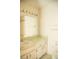 Clean bathroom with vanity, mirror, and shower at 6741 Willits Ave, New Port Richey, FL 34655