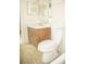 Simple bathroom with wood vanity and tile floor at 6741 Willits Ave, New Port Richey, FL 34655